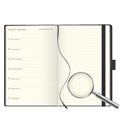 Carnet ouvert avec loupe. Aperçu hebdomadaire à gauche, page pointillée à droite. Couverture noire.
