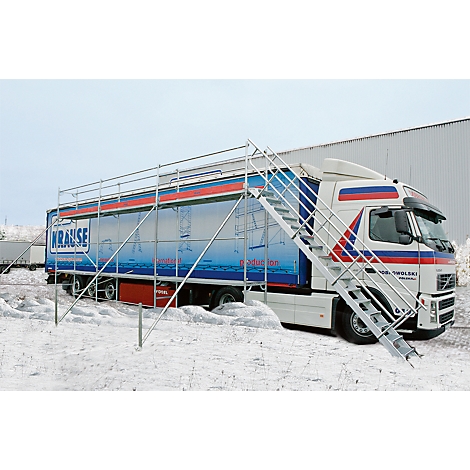 Truck with scaffolding and stairs in the snow. Inscription: KRAUSE. The picture shows the product in use.