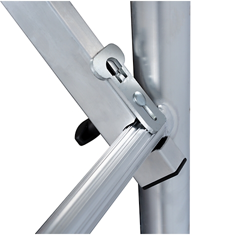 Close-up of metal joints. A bracket secures a diagonal pipe with a rivet.