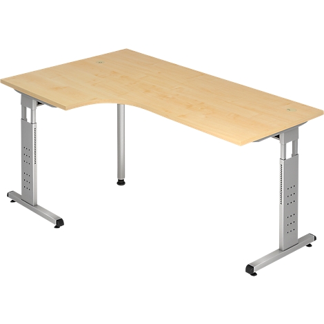 An L-shaped desk made of light wood. The frame is made of silver metal. The table is in a slightly elevated position.