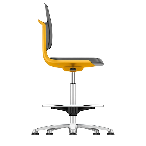 Yellow office chair in profile, gray backrest. Metal frame, footrest.