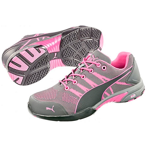 Grey and pink Puma safety shoes, with laces, sole and logo. The background is white.