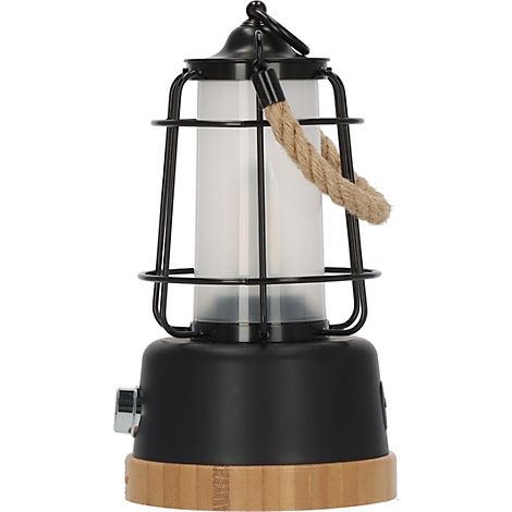 Une lanterne noire et jaune avec un cylindre en verre, entouré d'une grille en fil noir et une poignée en corde.