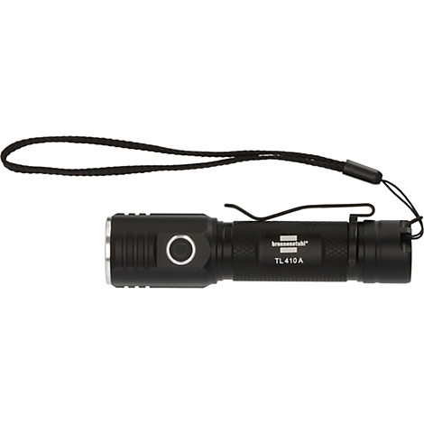 Une lampe de poche noire avec un clip latéral et un œillet distinctif, reconnaissable par sa forme robuste et sa surface antidérapante.