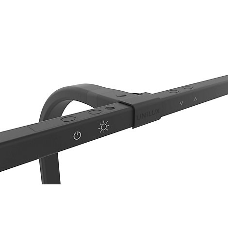 Gros plan d'une lampe de bureau noire avec des commandes et l'inscription "UNILUX".