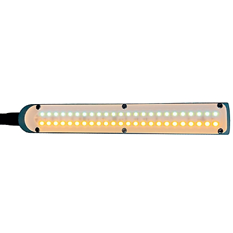 Langgestreckte LED-Leuchte mit weißen und gelben Lichtern. Das Gerät hat eine dunkelblaue Umrandung und ist mit Schrauben befestigt.