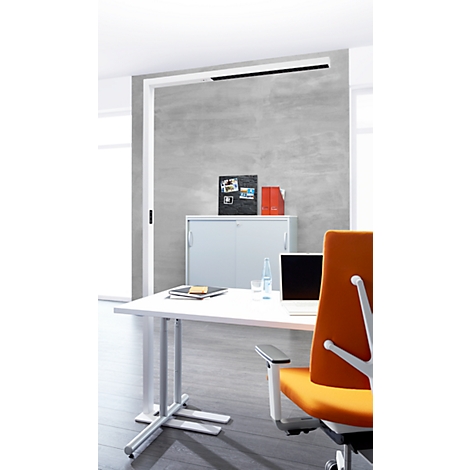 Office with desk, laptop, chair and cabinet. A fluorescent tube illuminates the room.
