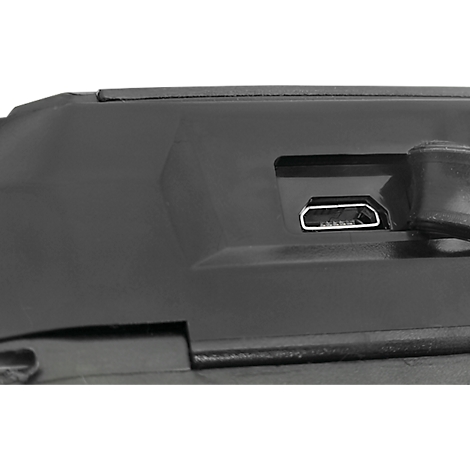 Close-up of a black plastic surface with a USB port.