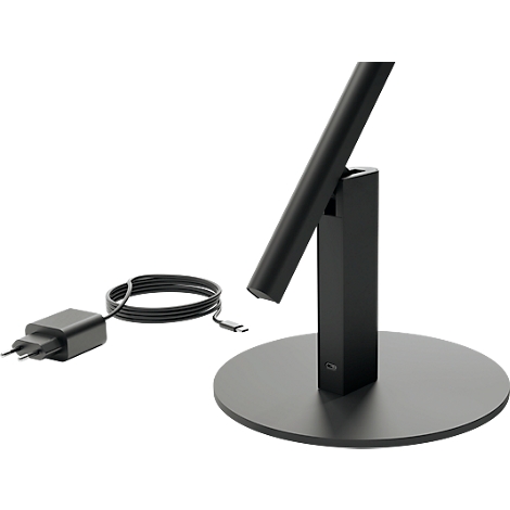 A black table lamp with a round base, the lamp arm, and a charger.