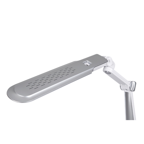 A silver desk lamp positioned at an angle against a white background. The lamp head has openings.