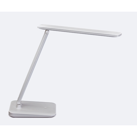 Witte bureaulamp op houten bureau, computerscherm, houten pop ernaast.
