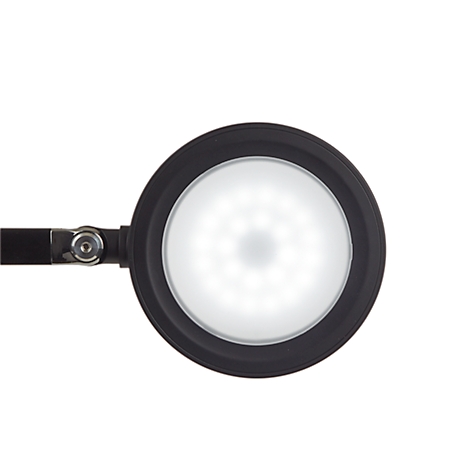 Nahaufnahme einer schwarzen, runden LED-Leuchte mit hellem, weißem Licht. Die Leuchte ist an einem schwarzen Arm befestigt.