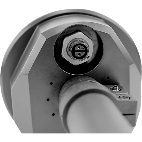 Close-up of a metallic component, centered on a hexagonal bolt with an insert, below a cylindrical element.