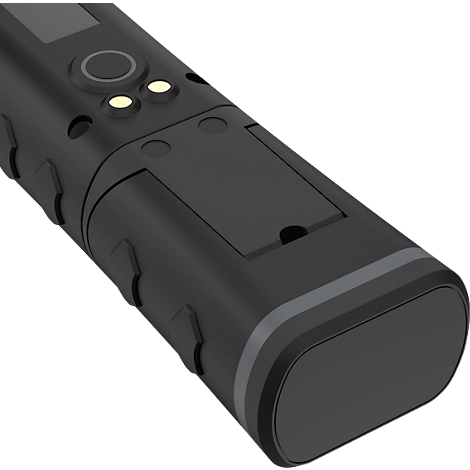 Black, oblong device with rounded corners. Buttons and indicators are on top, a cover is underneath.