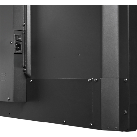 Vue détaillée du dos d'un écran noir, montrant le port d'alimentation et l'interrupteur.