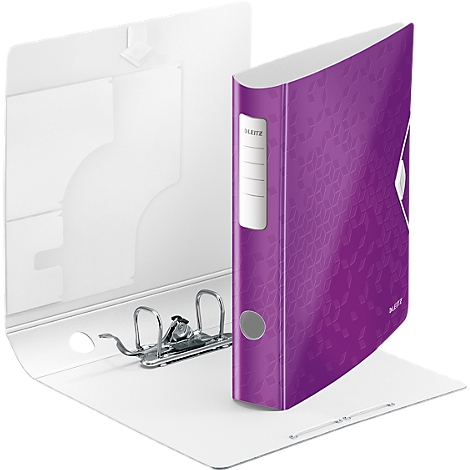 A purple binder with a white spine and floral pattern stands open on white paper.