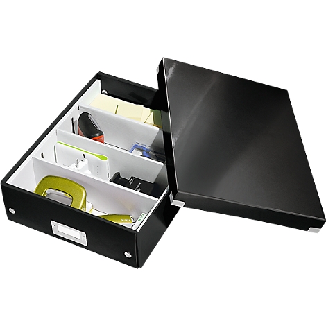 Black box with lid, filled with office supplies. Various items such as a hole punch, sticky notes, and a charger can be seen.