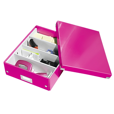 Pink storage box with an open lid, divided into compartments containing office supplies like a stapler and sticky notes.