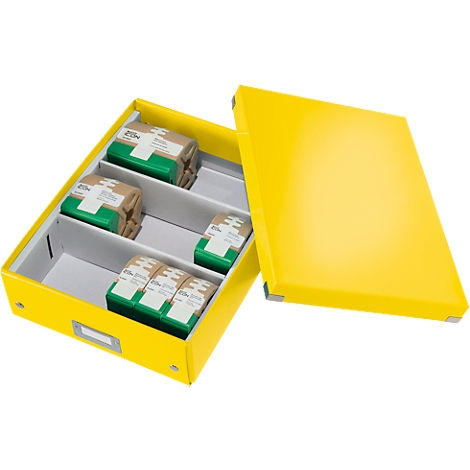 Yellow open file box, with medication in compartments. The lid is next to it.
