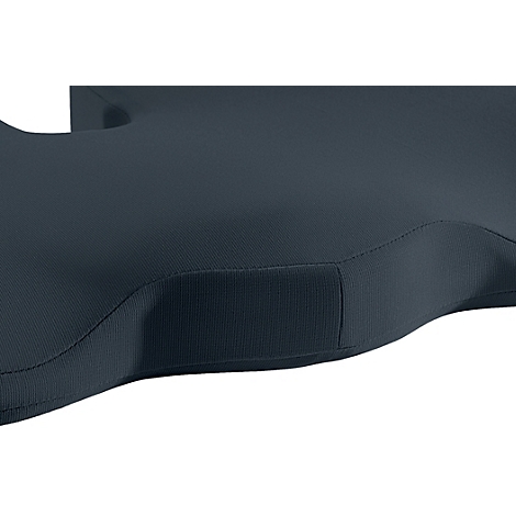 Gros plan sur un coussin de siège bleu foncé avec une texture côtelée et des bords arrondis.