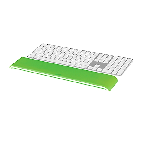 A white keyboard with gray keys lies on a green wrist rest.