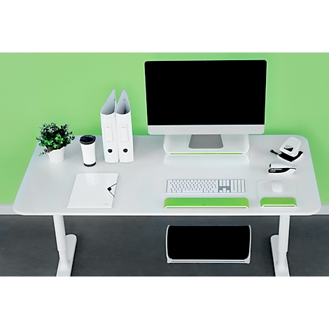 White desk with computer, green accent. Folders, plants, mouse and keyboard. Background: Green.