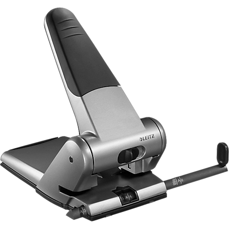 Gray Leitz hole punch with black handle and guide rail. The device stands on a black base plate.
