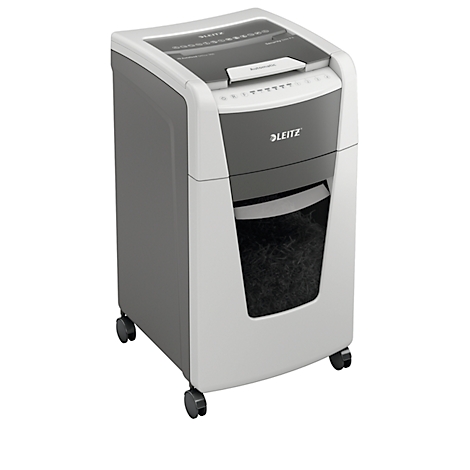 White and gray paper shredder with wheels and LEITZ logo. Paper is being shredded. Housing with input and collection container.
