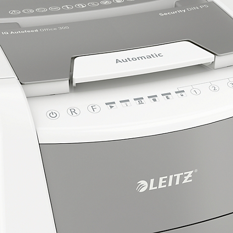 Close-up of a grey paper shredder with the word "Automatic".