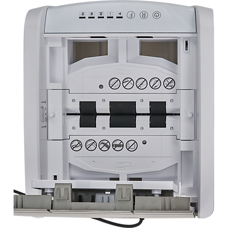 Close-up of a white paper shredder. Function symbols are at the top. Several stacked elements, some with symbols and black tape.