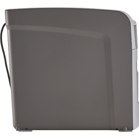 Gray device, side view. Black cable on the left. White details and feet on the bottom right.