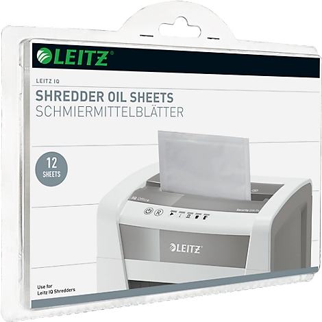 Package with shredder oil sheets, with a shredder in the background.