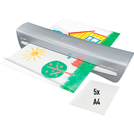 A laminator laminates children's drawings. On the sheet of paper you can see a sun, a tree and a house. Laminating pouches are next to it.
