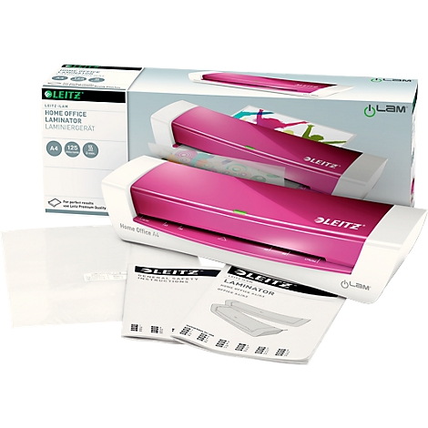 A pink Leitz laminator with accessories. The box and instruction manuals are next to it.
