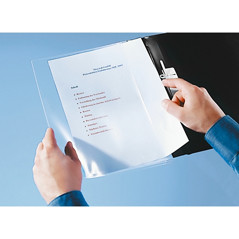 Two hands holding a transparent sheet protector with documents. The background is light blue.