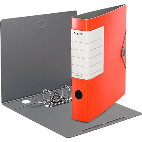 A red Leitz binder stands open on a gray surface. The binder has a white label with lettering.