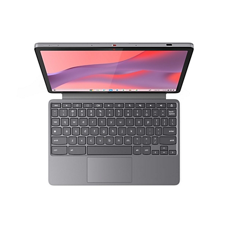 Ein graues Tablet mit angebrachter Tastatur, offen, Bildschirm mit Farbverlauf. Tastatur mit Buchstaben, Zahlen und Sonderzeichen.