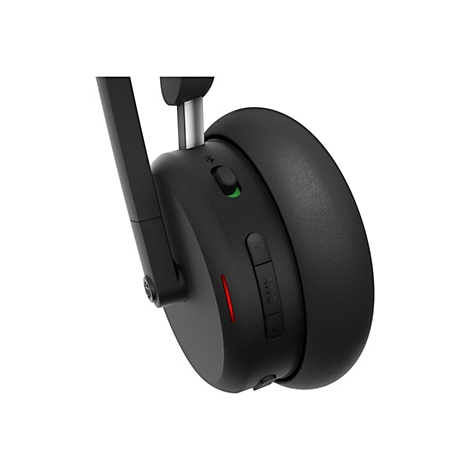 Gros plan d'un casque noir. Sur le côté, il y a des boutons pour la réduction du bruit et le volume, ainsi qu'un indicateur.