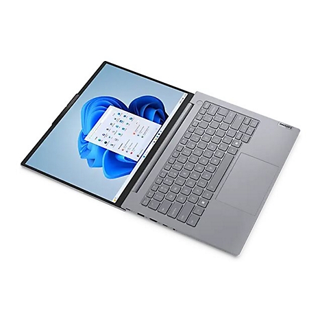 Grauer Lenovo-Laptop, geöffnet mit Windows 11-Desktop, eine App im Vordergrund.