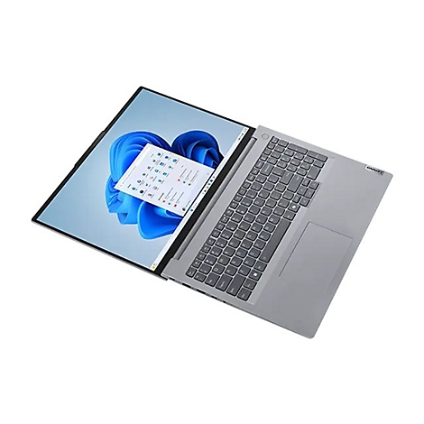 Graues Lenovo Laptop von oben, Bildschirm zeigt Windows-Hintergrund. Tastatur, Touchpad und Lenovo-Logo sind deutlich sichtbar.