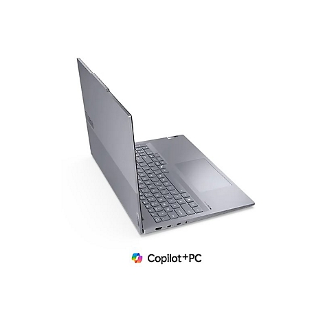 Grauer Laptop, leicht geÃ¶ffnet, vor weiÃŸem Hintergrund. Der Laptop ist leicht schrÃ¤g gestellt, um Tastatur und Touchpad zu zeigen. Am unteren Rand steht Copilot+PC.