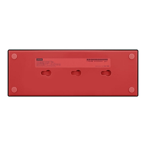 Face infÃ©rieure rouge d'un appareil Lenovo. Trous et Ã©tiquettes visibles.
