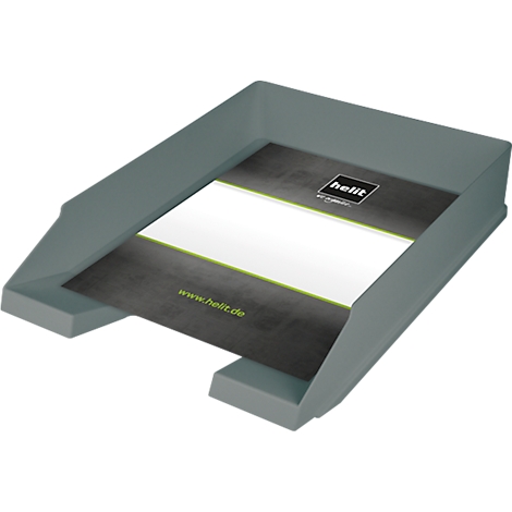 Grey desk tray with paper. On the paper is a logo and the lettering www.helit.de.