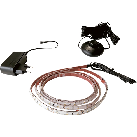 Various parts of an LED strip: power supply, foot switch, strip with LEDs.