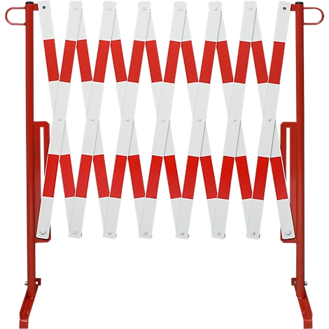 Expandable red and white striped barrier. Mounted on a red metal frame, for securing areas.