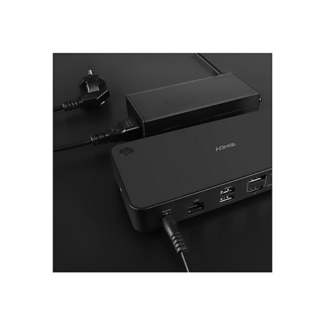 Schwarz-graue Dockingstation mit Stromkabel und Adapter. Aufschrift 'NOKIA' auf der Oberseite.