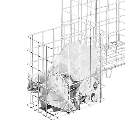 A white wire basket filled with crumpled paper, against a white background.