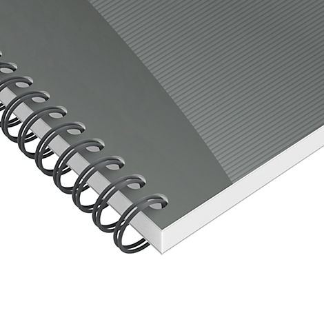 Bloc-notes gris avec reliure spirale et surface côtelée, gros plan.