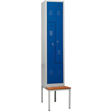 A blue locker with two doors with a bench attached.