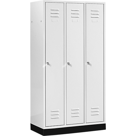 White locker with three doors and ventilation slots. The locker stands on a black base.